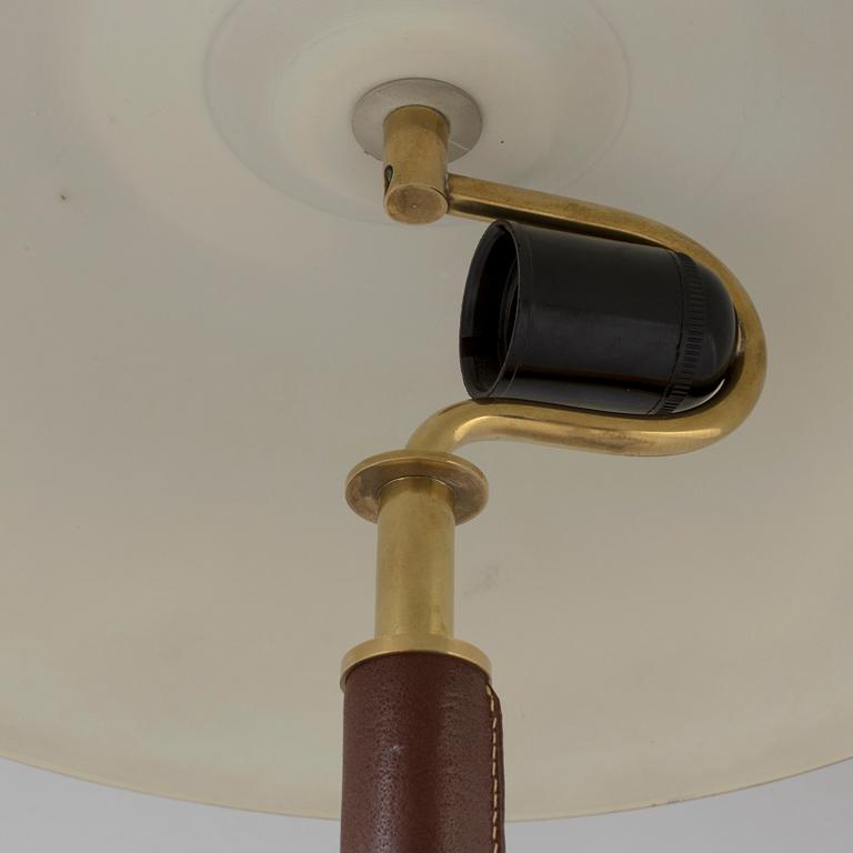 A brass and leather table light from Falkenbergs Belysning, second half of the 20th Century.