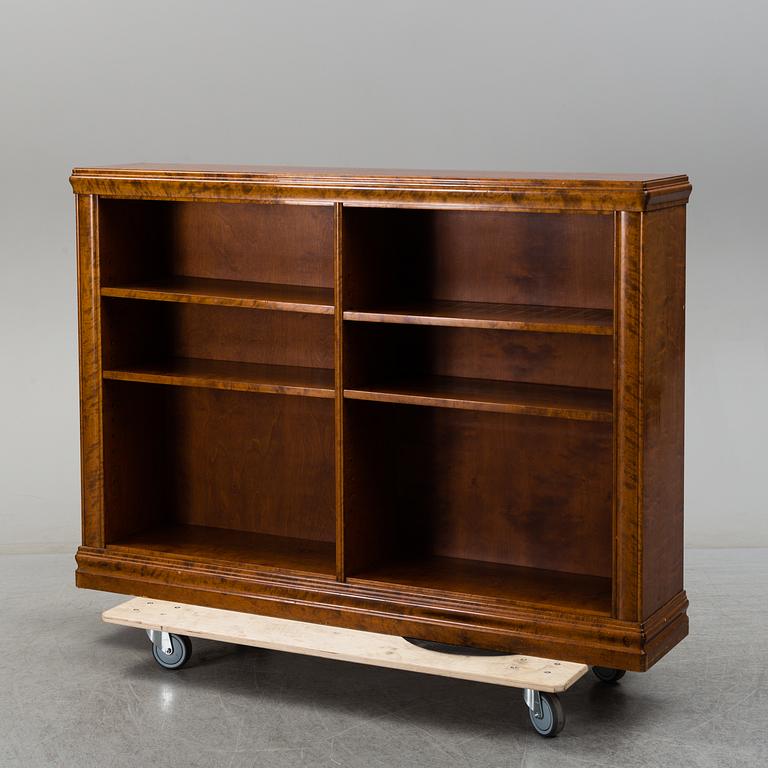 A 1930s birch veneered shelf.