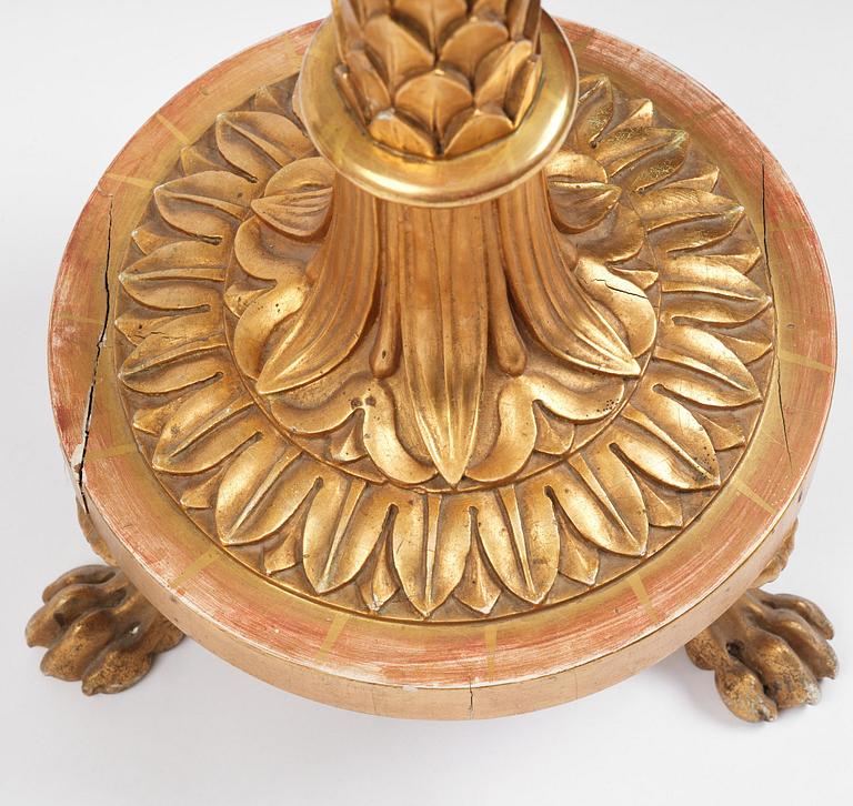 A pair of late Gustavian giltwood torchères by J. Frisk (master in Stockholm 1805-24).