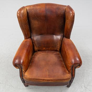 A leather upholstered easy chair , second half of the 20th Century.
