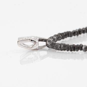 Necklace, Atelier Ajour, black diamonds with a star pendant set with brilliant-cut diamonds.