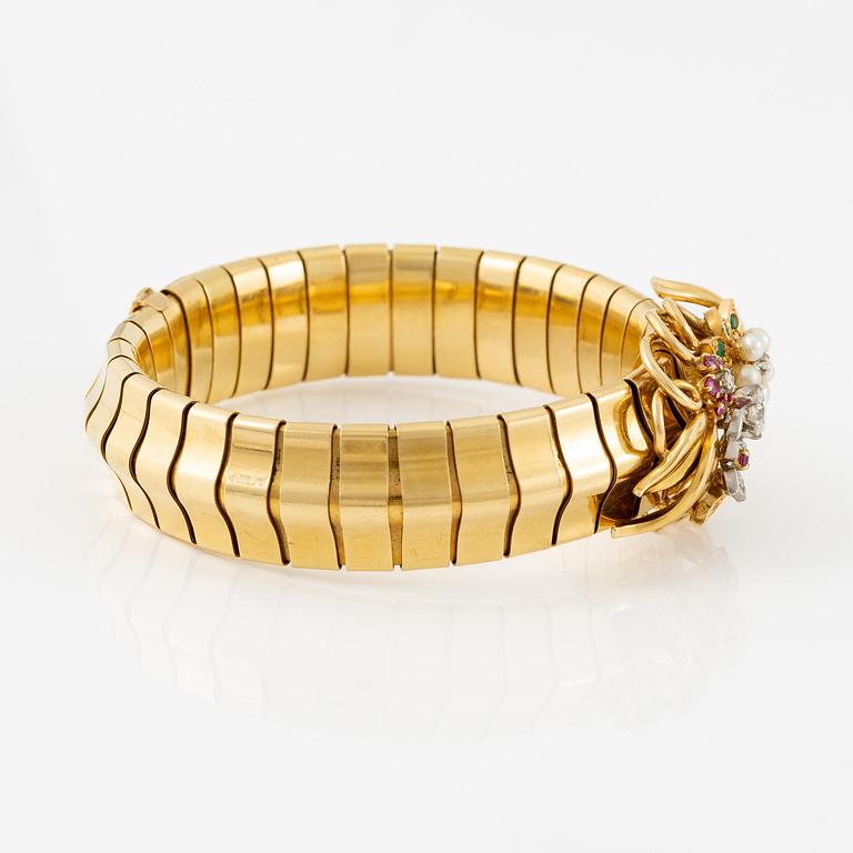 A Strömdahls bracelet/pendant combination in 18K gold with rubies, emeralds, pearls and diamonds.