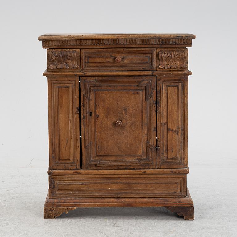 A Baroque style cabinet, circa 1900 with older parts.