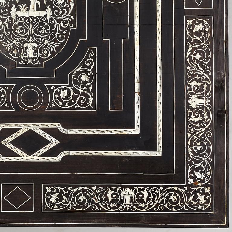 A Renaissance-style ebony, ebonized and ivory-inlaid library table, late 19th century, presumably Germany.