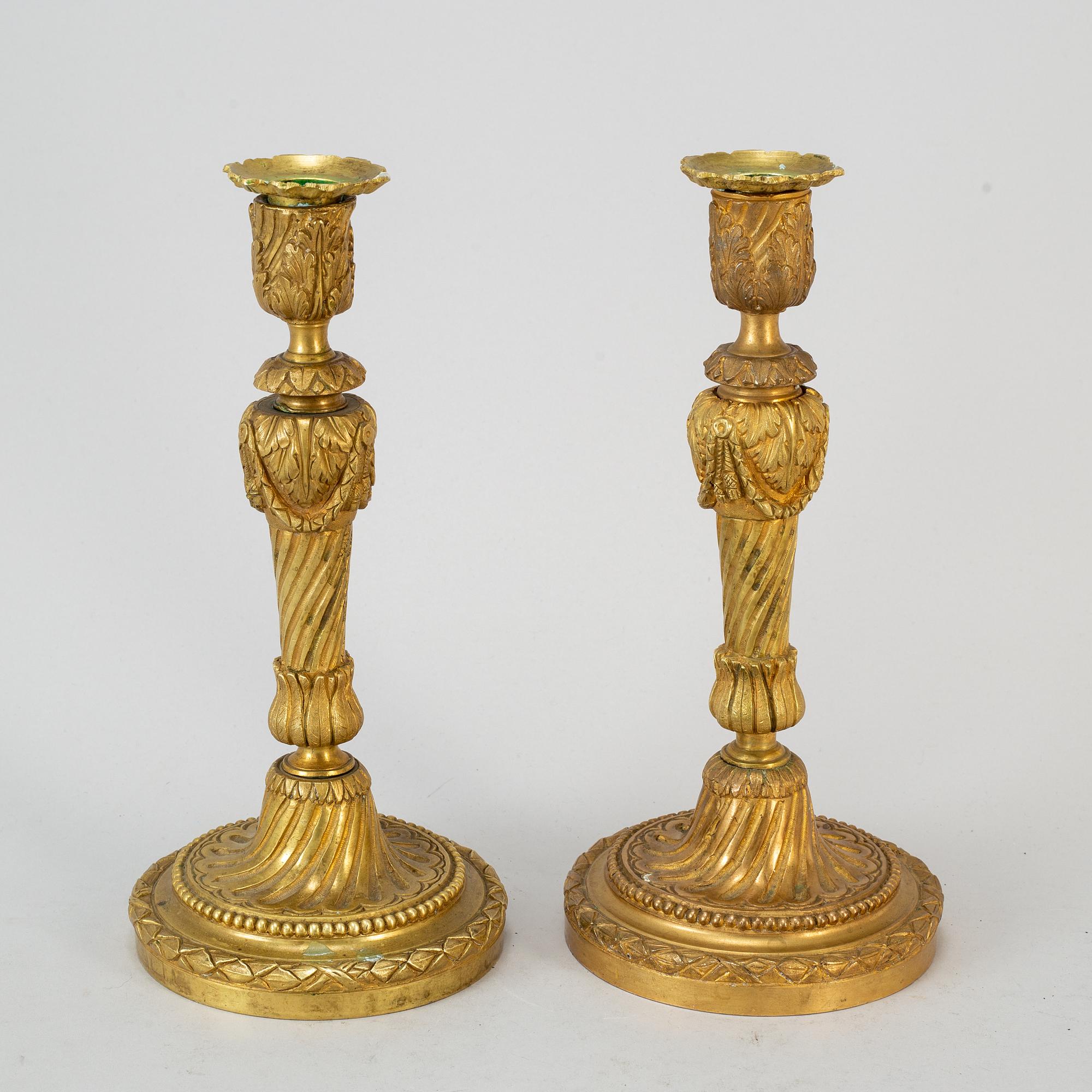 A pair of Louis XVI style candlesticks. Ca 1900.
