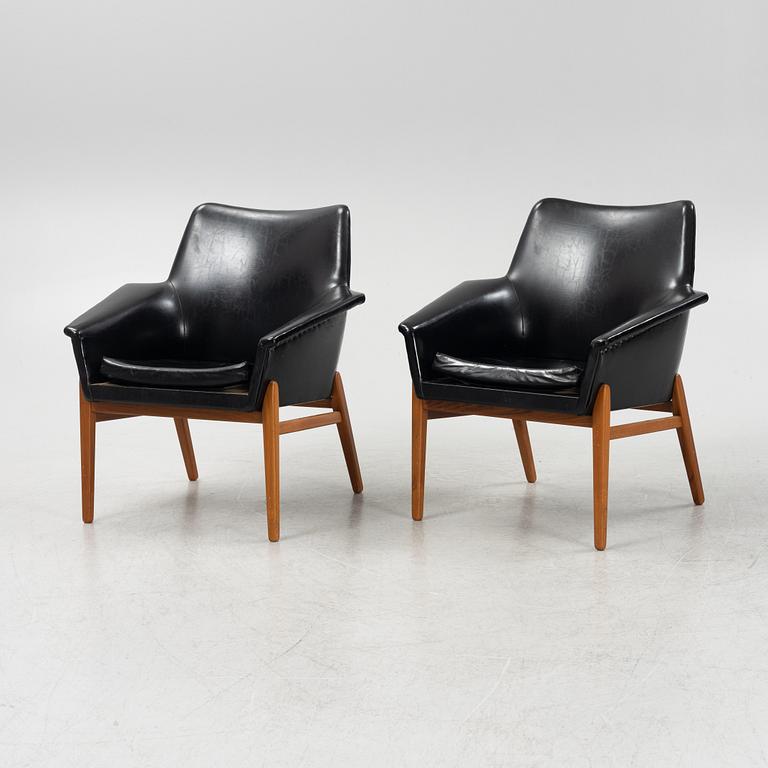 Chairs, a pair of leather, from the 1960s.