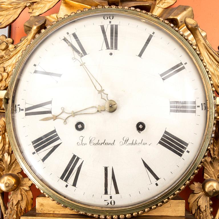 A gilded late Gustavian wall clock first half of the 19th century signed Jonas Cedelund.