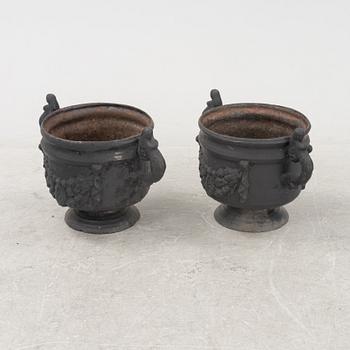 A pair of cast-iron urns from Stafsjö Bruk, 20th Century.