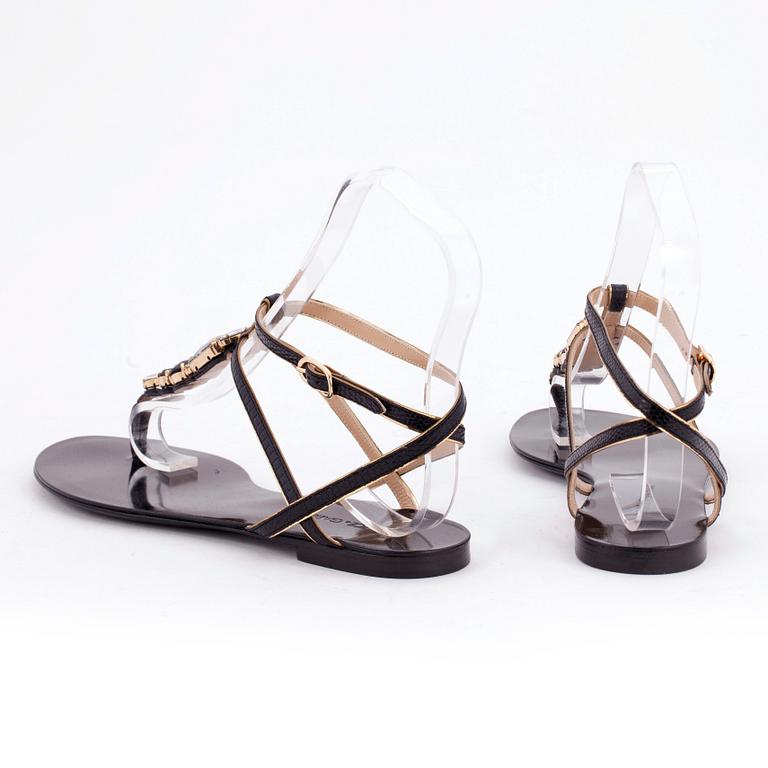 DOLCE & GABBANA, a pair of black leather sandals.