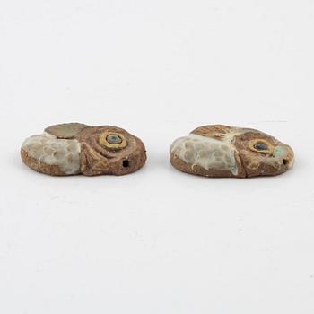 Tyra Lundgren, two stoneware pendants.