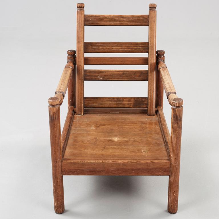 An Axel Einar Hjorth stained pine 'Sandhamn' armchair, Nordiska Kompaniet 1929.