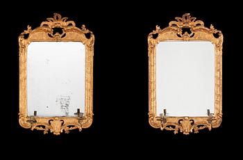 716. A pair of Swedish Rococo 18th century two-light girandole mirrors.