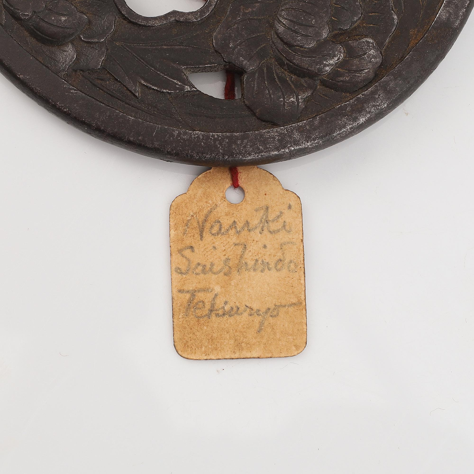 A Japanese iron Tsuba, Edo, signed Nanki Seishindo.