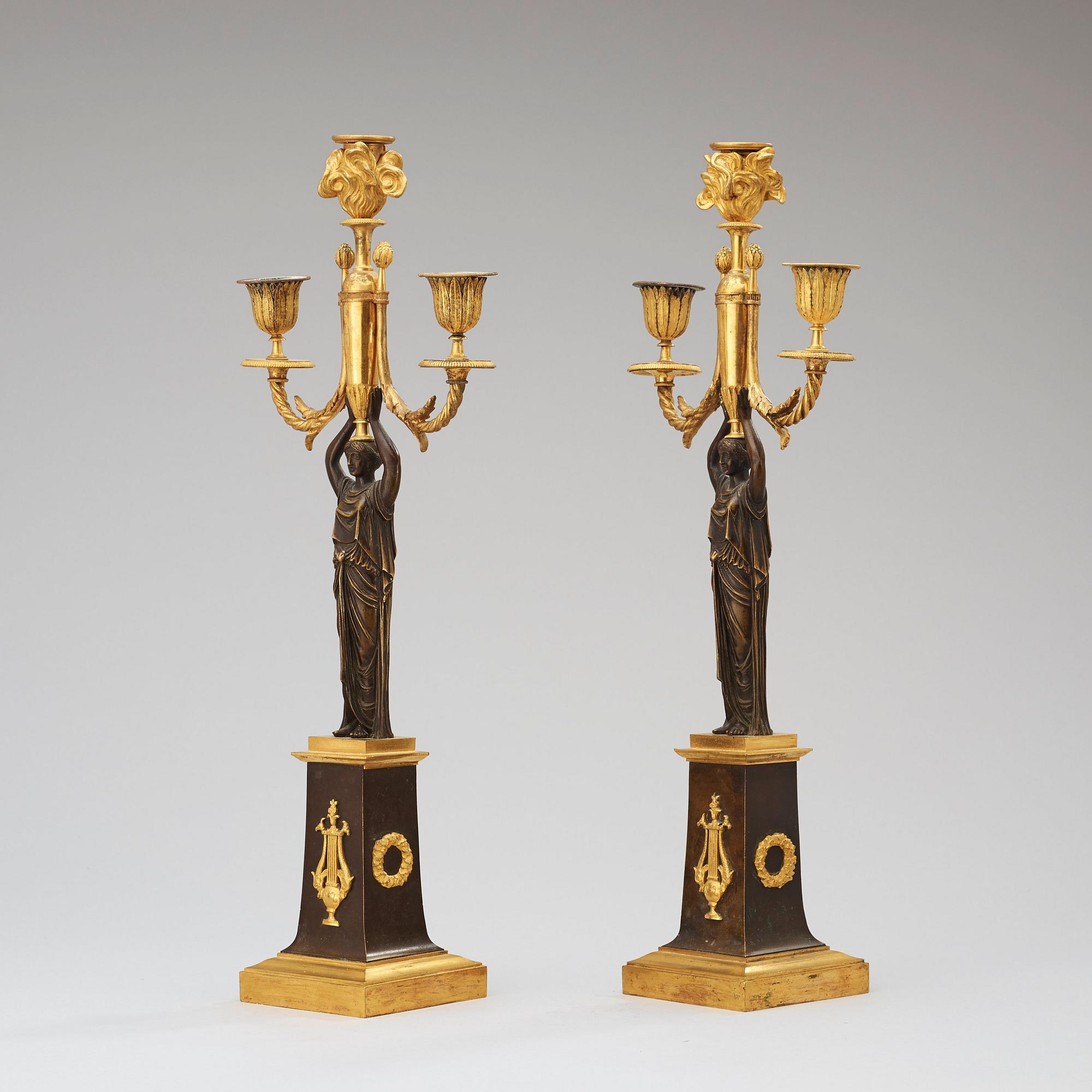 A pair of  Empire early 19th century three-light candelabra.