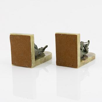 A pair of onyx and patinated bronze bookends, 1920's.