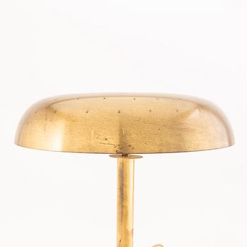 A brass table lamp possibly by Bertil Brisborg, from the mid 20th century.