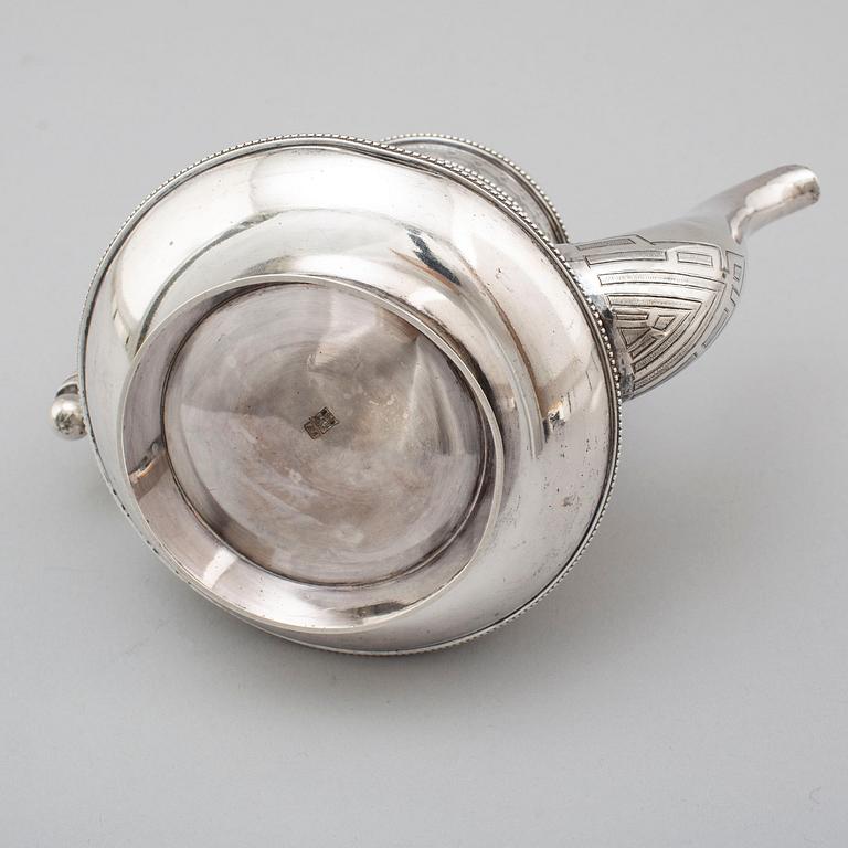 A Russian 19th century parcel-gilt silver tea pot and cream jug, mark possbly of Alexander Lokin, St. Petersburg 1893.