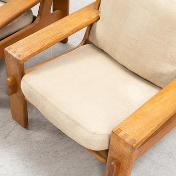 Esko Pajamies, a pair of oak 'Bonanza' lounge chairs from Asko, 1970's.