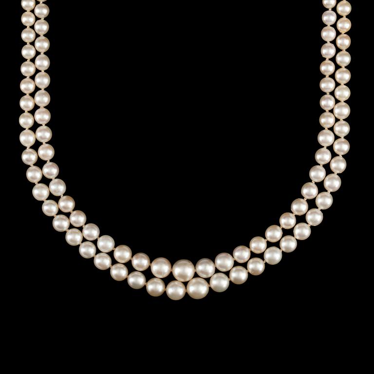 A 2-strand cultured pearl necklace. Clasp in the shape of the letters 'EJ' set with brilliant-cut diamonds.