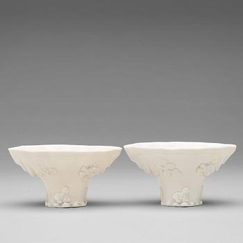 456. Two blanc de chine rhinoserous shaped libation cups, Qing dynasty, Kangxi (1662-1722).