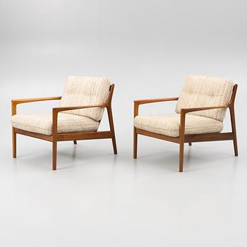 Folke Ohlsson,a pair of 'USA 75' armchairs, Dux.