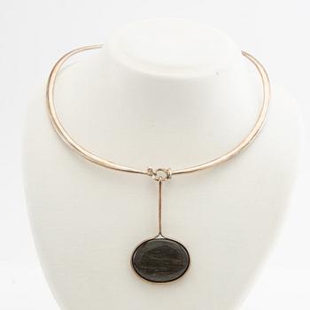 Vivianna Torun Bülow-Hübe, Necklace with pendant and a pair of earrings by Georg Jensen, Denmark, sterling silver and stone.
