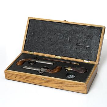 A cased pair of Belgian percussion pocket pistols, mid 19th century.
