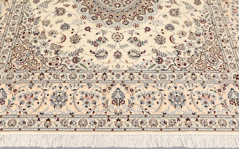 A Nain part silk carpet, c. 207 x 208 cm.
