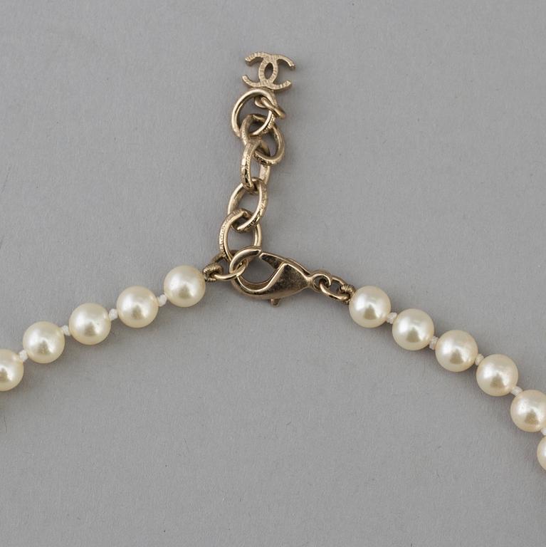 A necklace by Chanel, 2015.