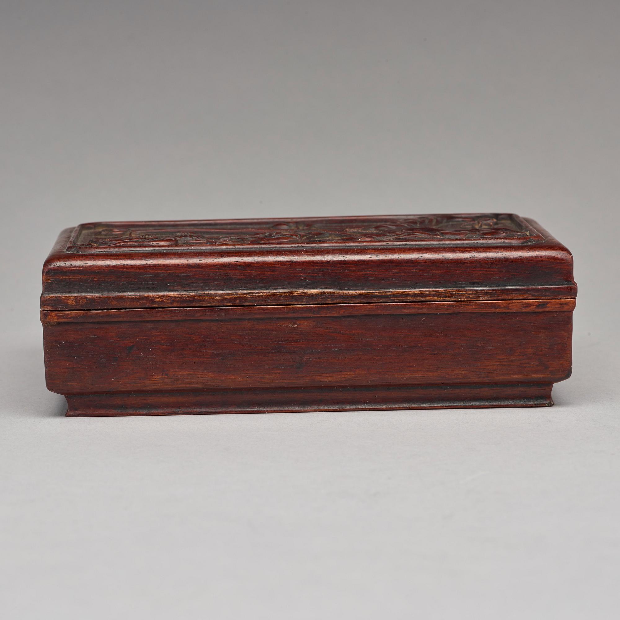 A Chinese wooden box, circa 1900.
