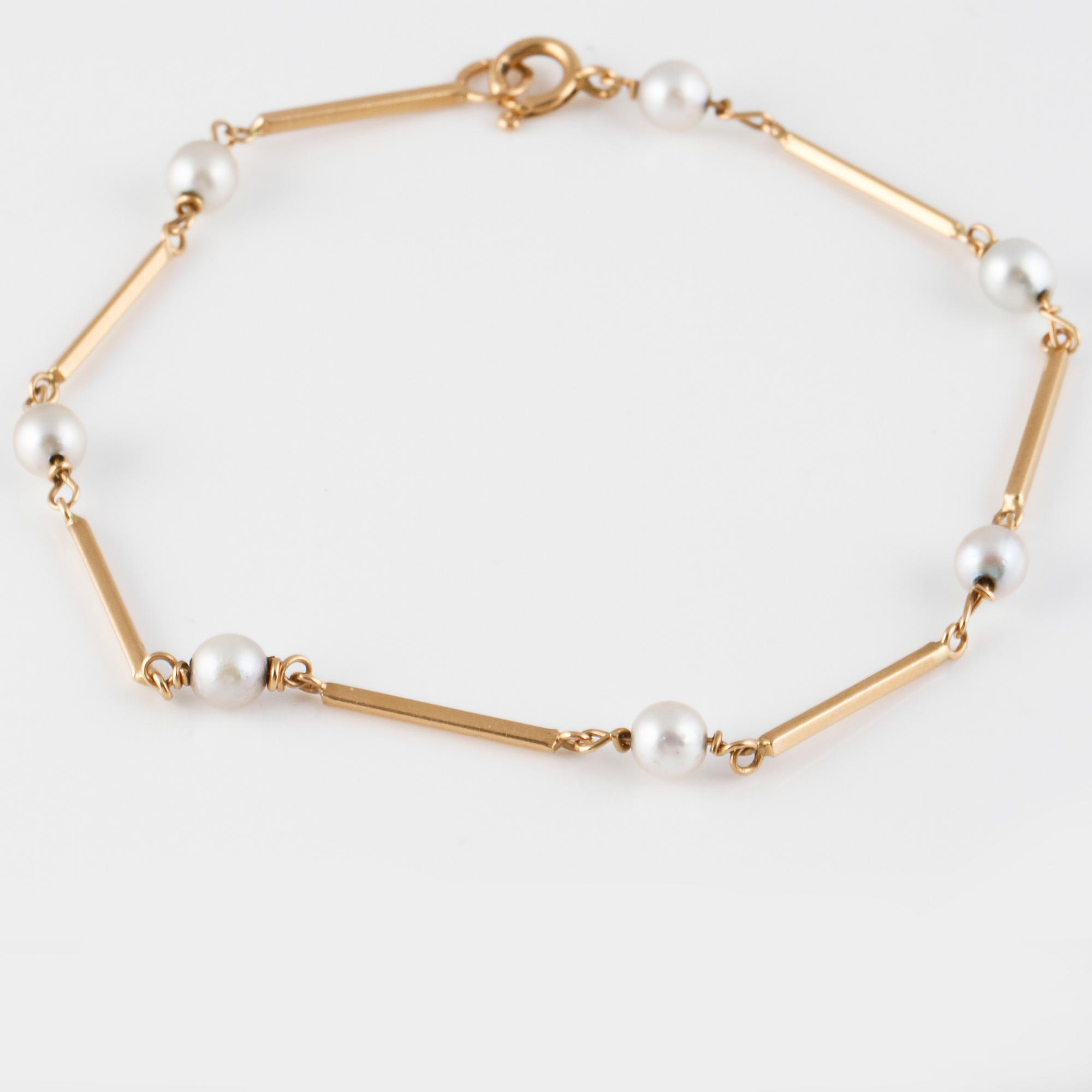 ARMBAND, 18K guld med 7 odlade pärlor, kattfotstämplat 1961. Vikt 3,7 gram.