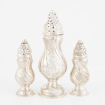 A set of three silver Rococo style shakers, 20th Century.
