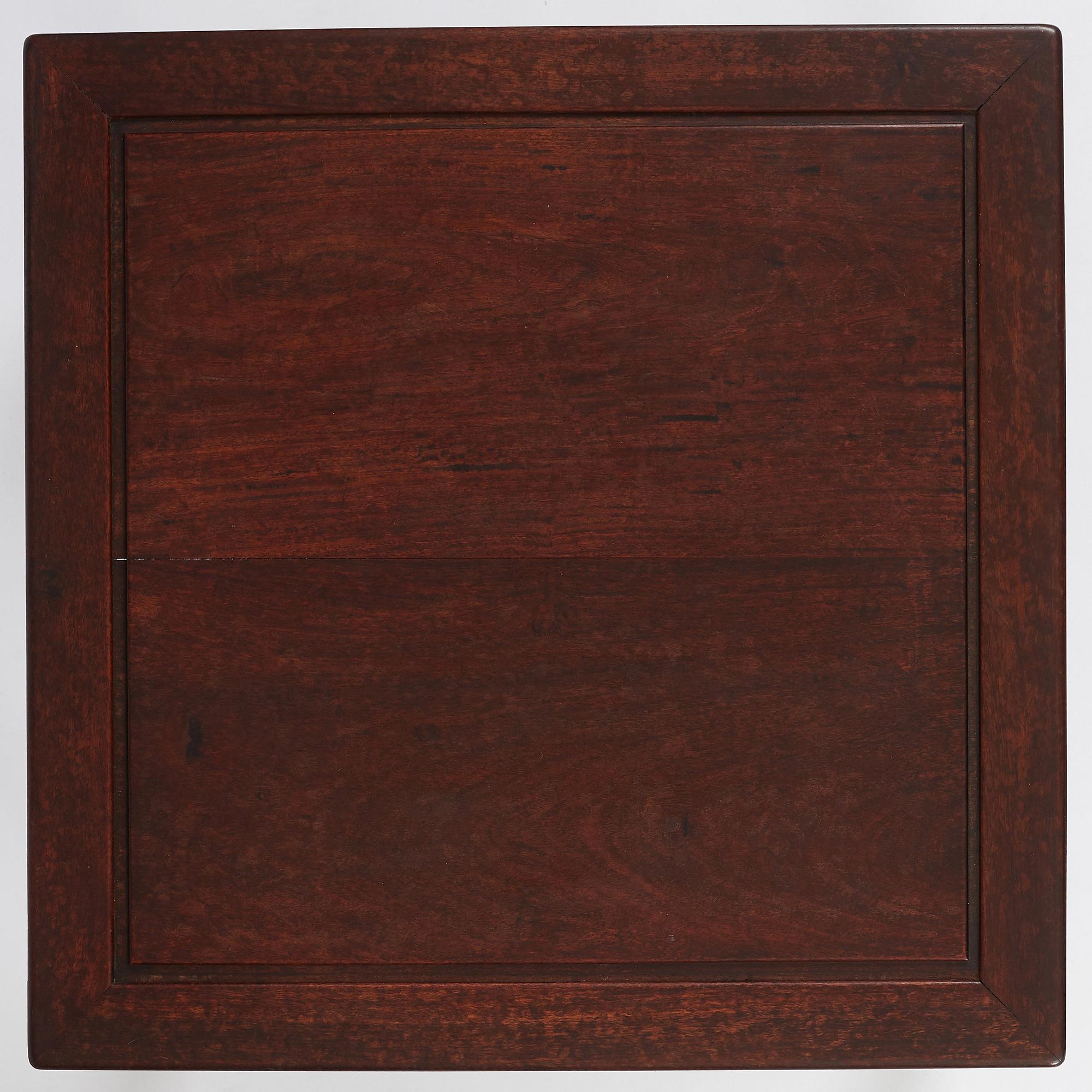 A Chinese hardwood corner-leg table, Qing dynasty.