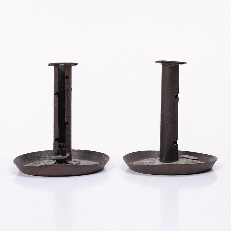 A pair of similar candle holders, 19th century.