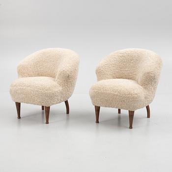 A pair of Swedish Modern armchairs, mid 20th century.