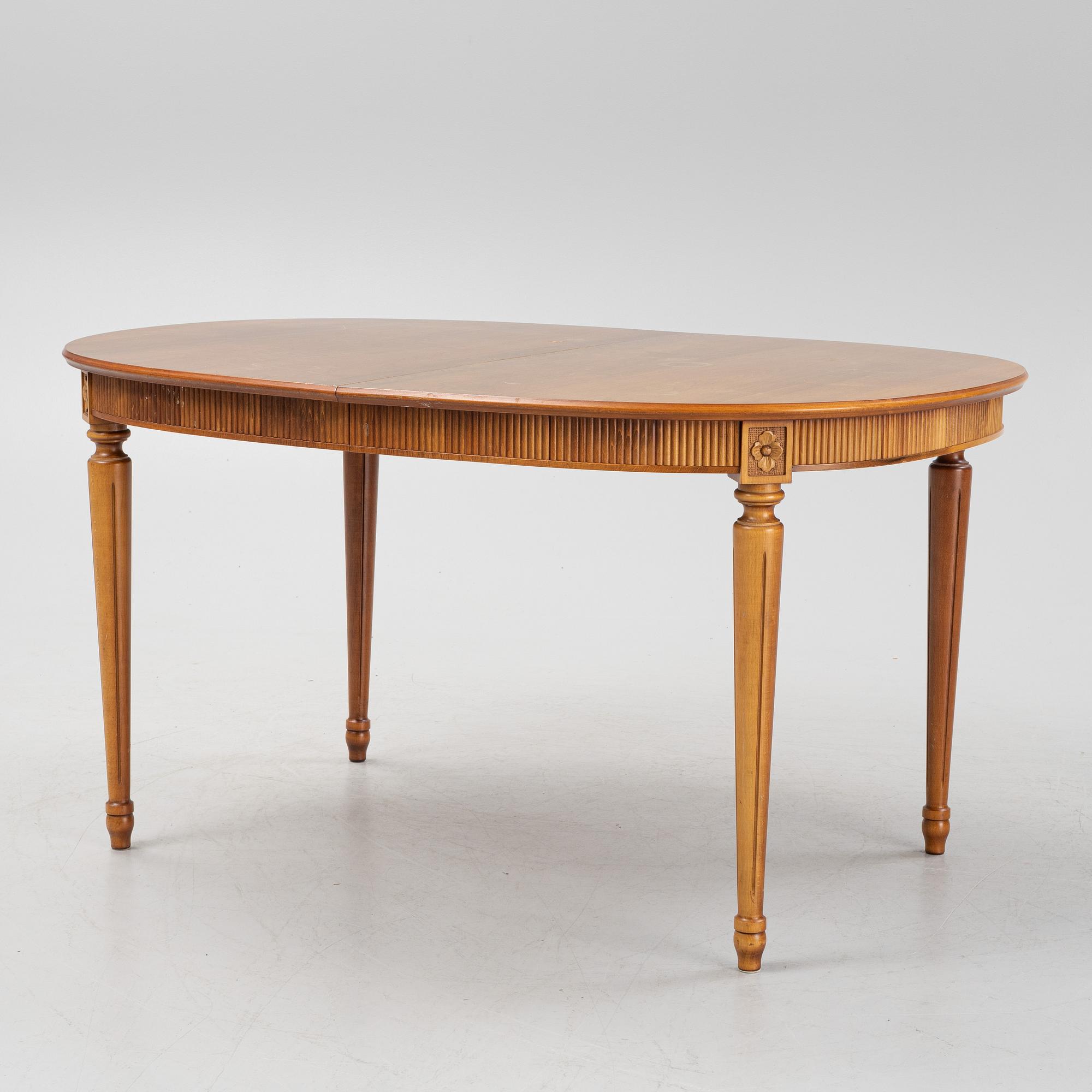 A Gustavian style dining table with two armchairs and four chairs, late 20th century.