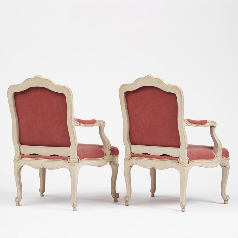 A large pair of Swedish Rococo armchairs in the manner of O Höglander (1750-1765).