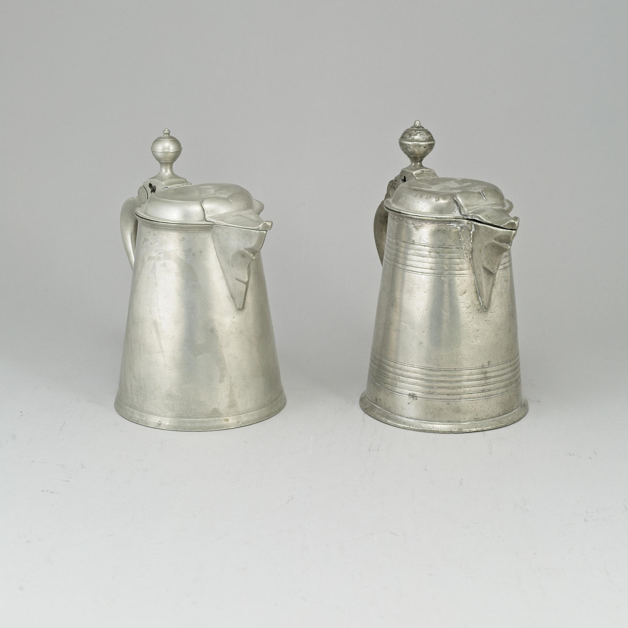 Two pewter tankards, one by Carl Petter Eckerström, Västerås 1833.