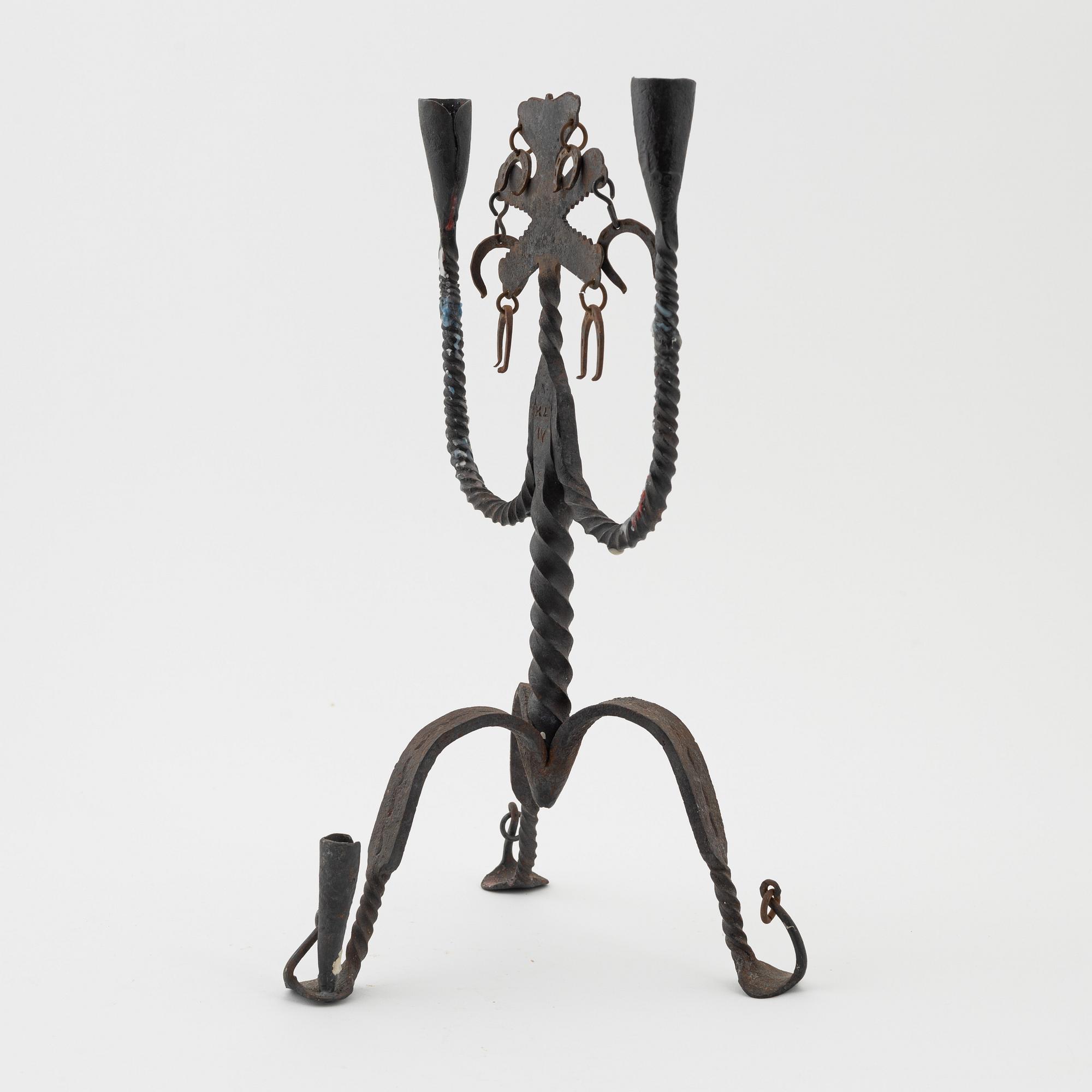 A Seedish wrought-iron three-light candlestick, circa 1900.