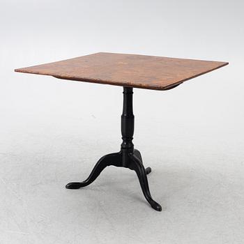 A tilt-top table, around 1800.