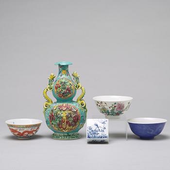 Three Chinese famille rose bowls, a vase and a jar with cover, 20th century.