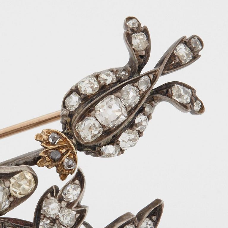 A BROOCH set with old-cut diamonds.