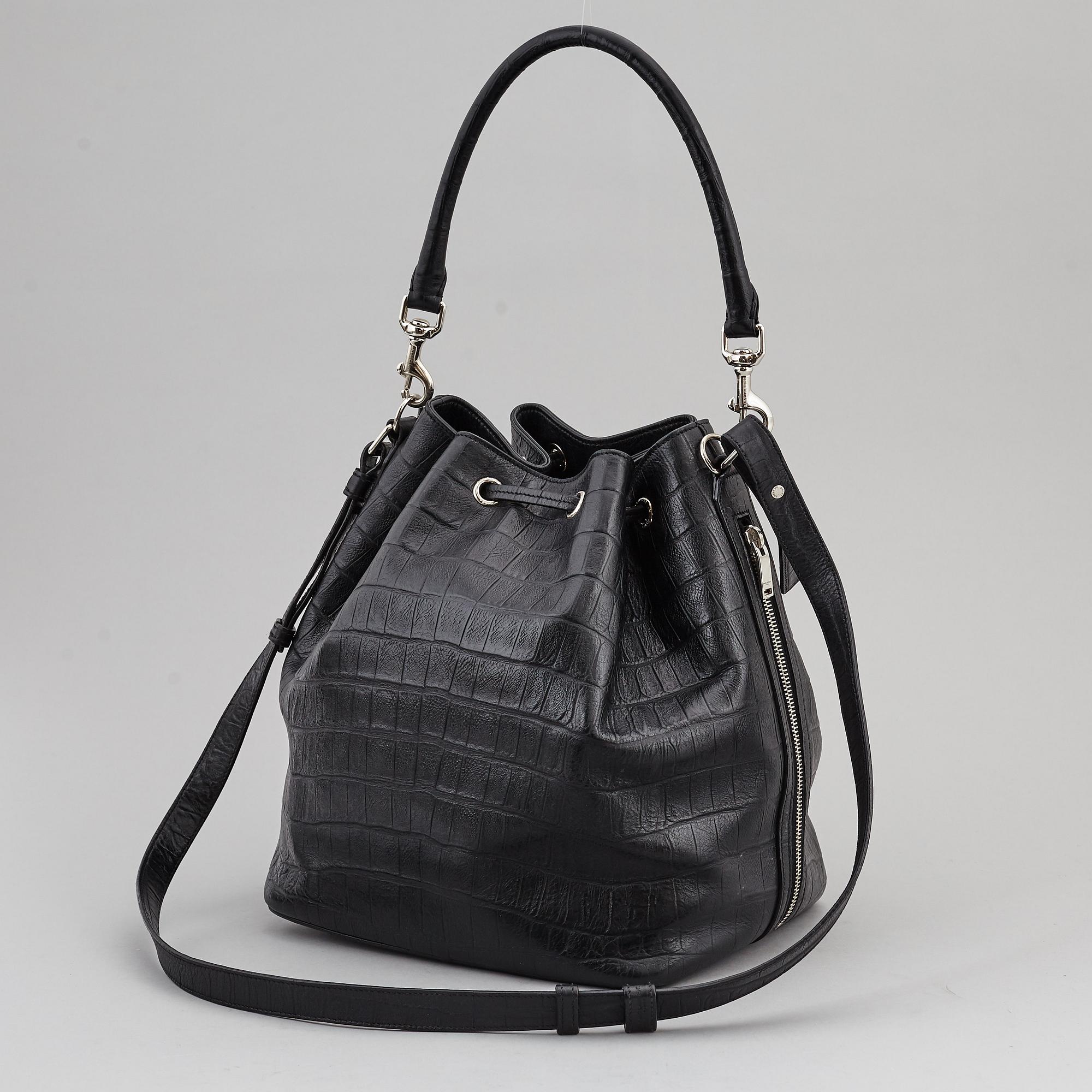 YVES SAINT LAURENT, a black leather 'Emmanuelle' bag.