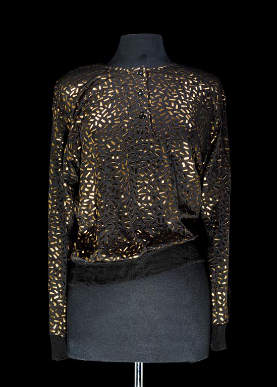 A blouse by Yves Saint Laurent.