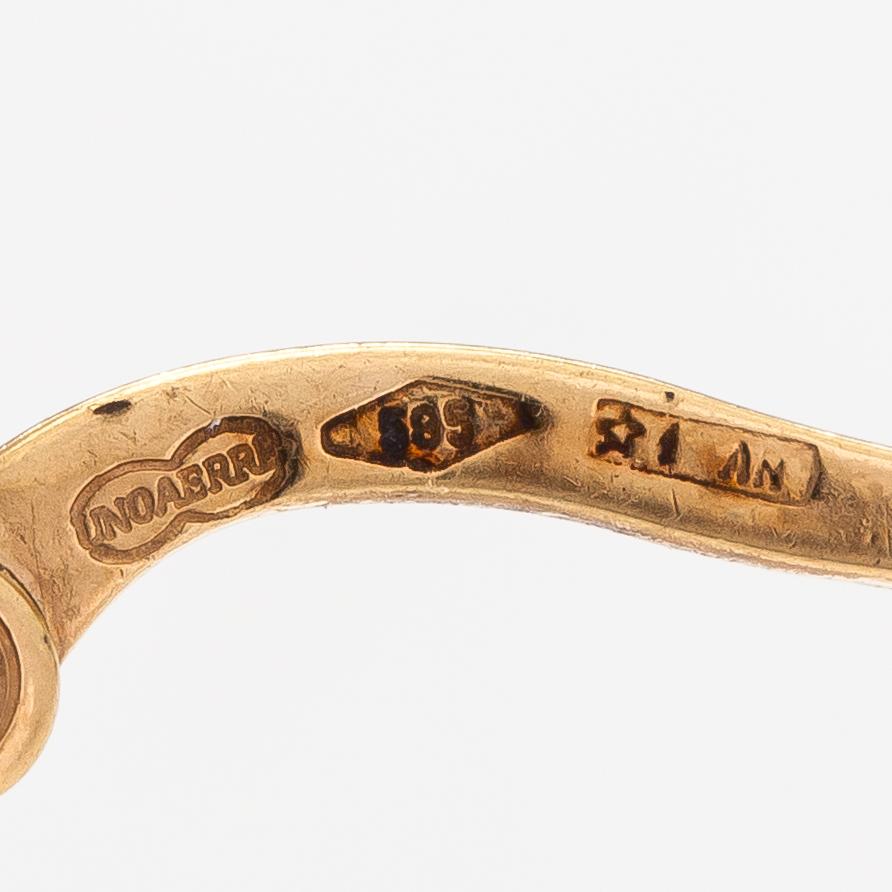 A pair of 14K gold earrings. Unoaerre.