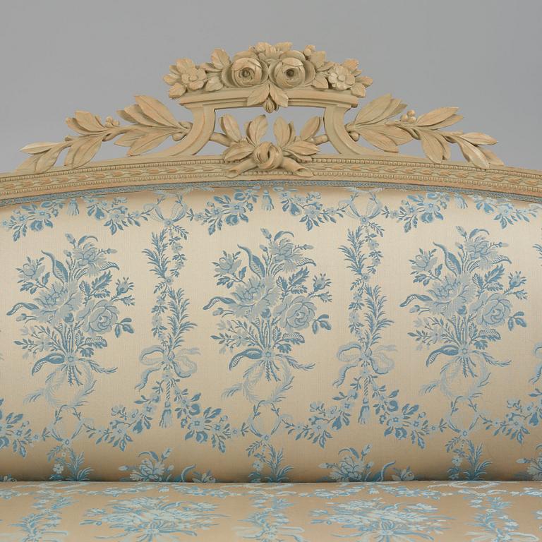 A grey-painted Gustavian 'canapé en corbeille'. sofa, later part of the 18th century.