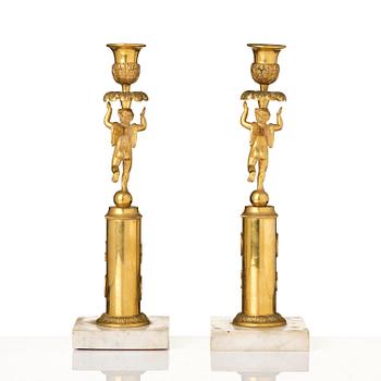 A pair of late Gustavian marble and omrolu candlesticks, late 18th century.