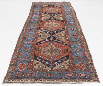 A Heris runner, antique, c. 325 x 88 cm.