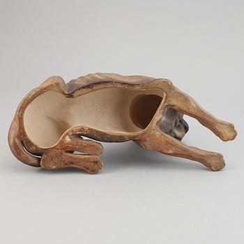 A ceramic sculpture in the shape of a dog, 20th century.