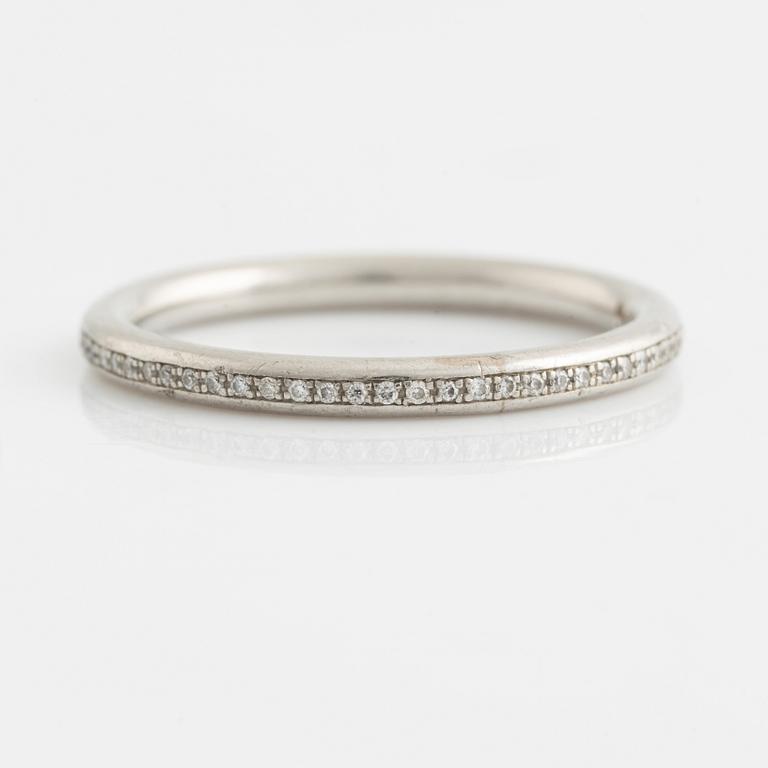 A platinum eternity band set with diamonds.